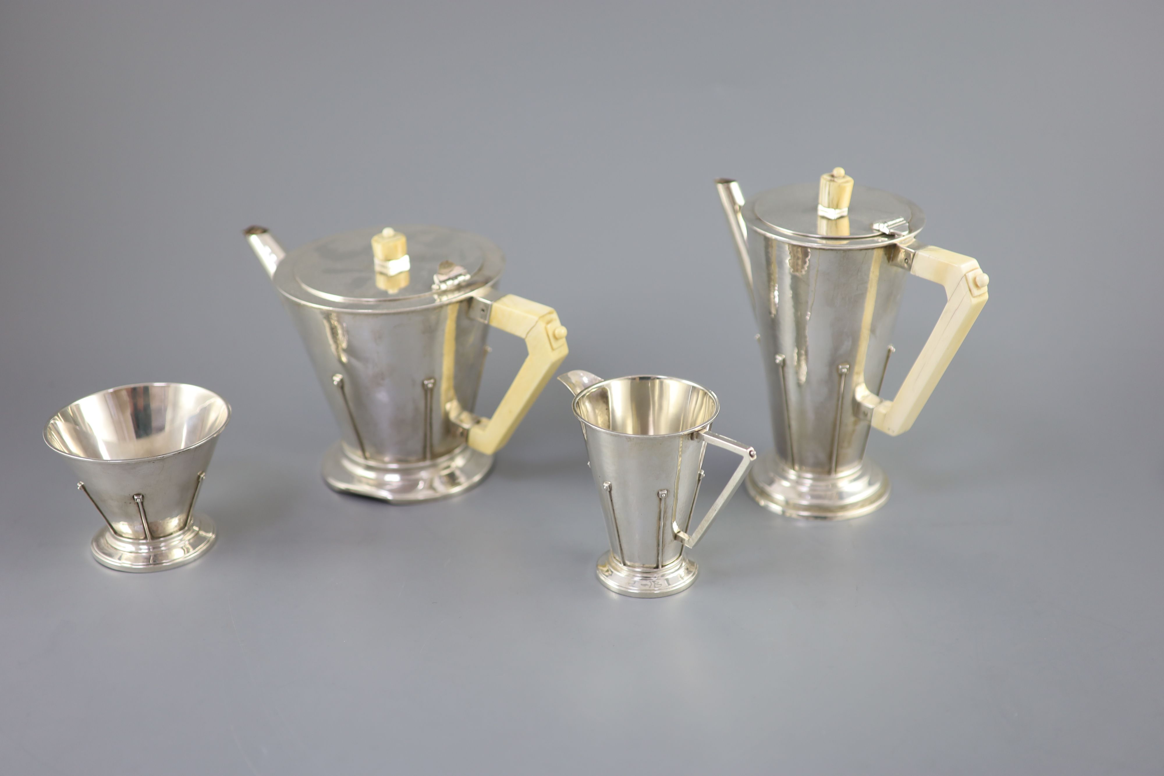 A stylish 1930s Art Deco silver four piece tea and coffee service by Charles Boyton,